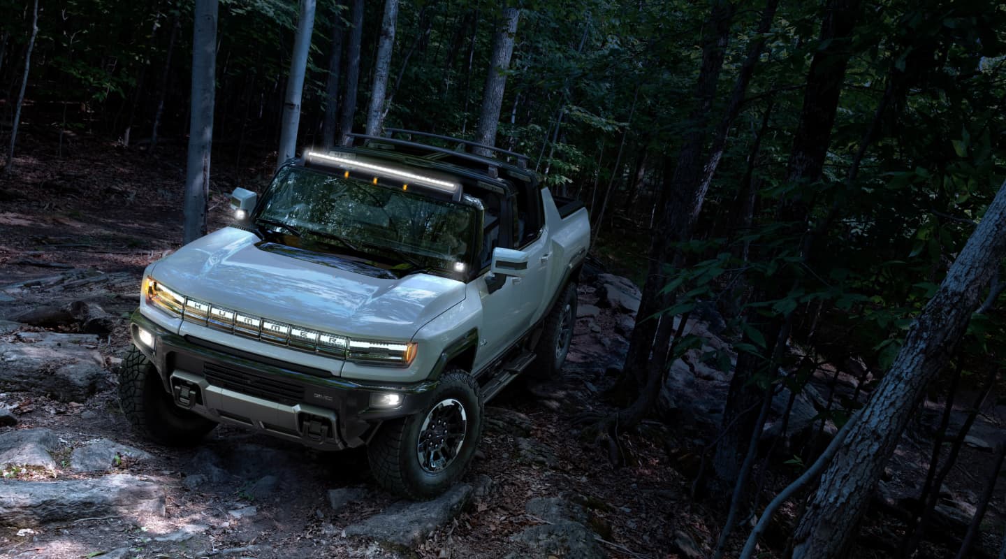 Hummer Pickup off-roading in forest